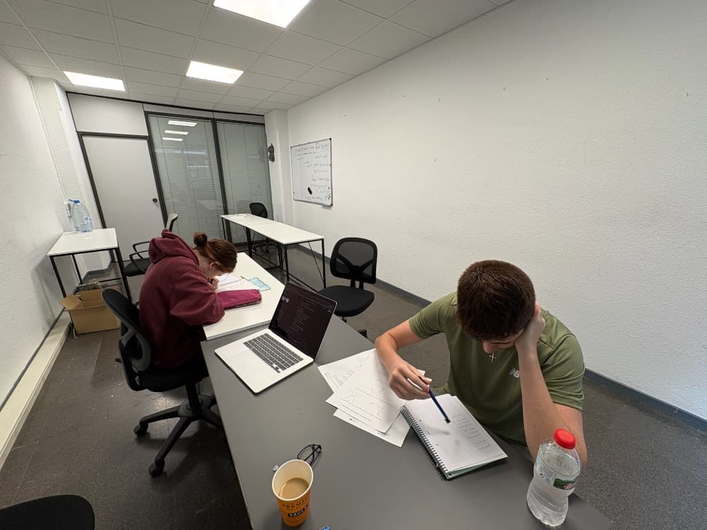 Students in a focused in-person tutoring room in Barcelona.